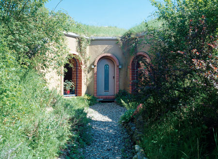 
The sunroom opens to the back garden. The unassuming exterior is all part of the attraction in creating a home that so perfectly fits its environment.
